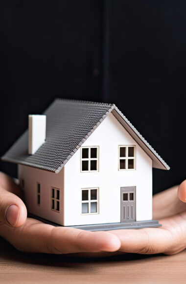 woman showing with one hand a mini house. Real state concept. Ai generative