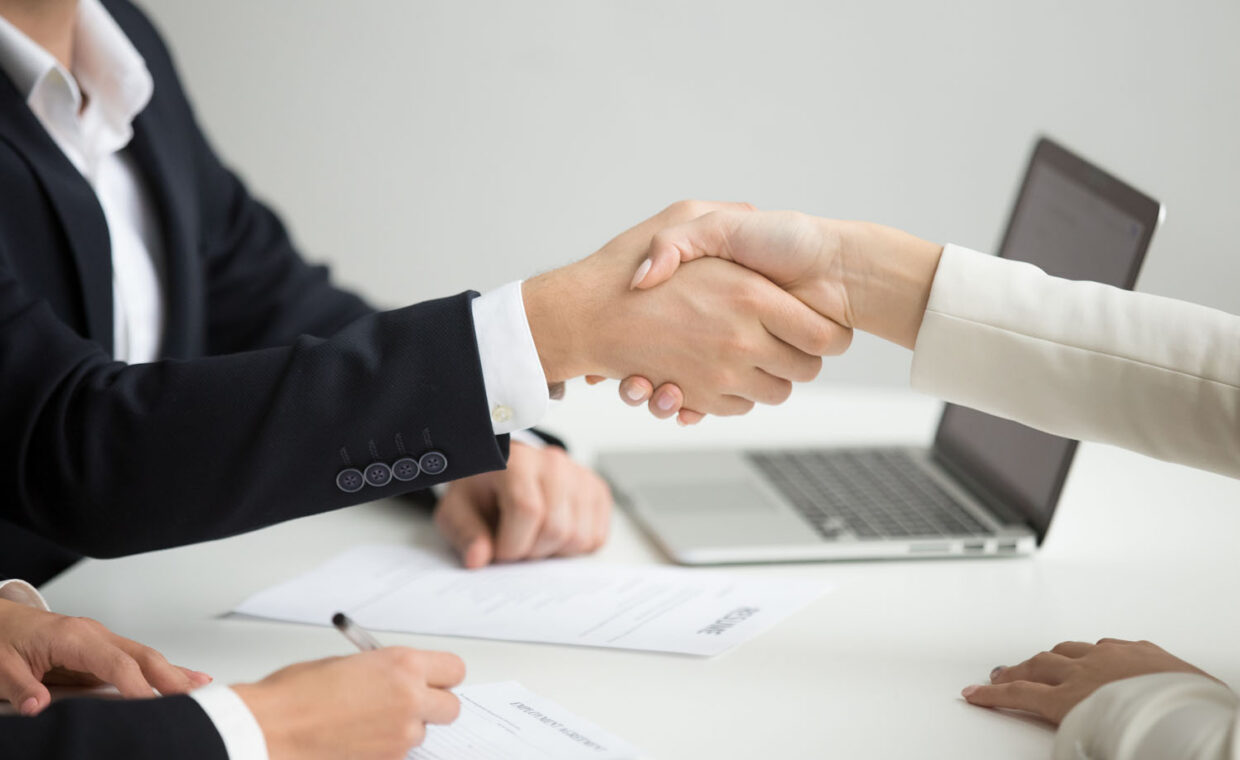 Hr handshaking successful candidate getting hired at new job, cl