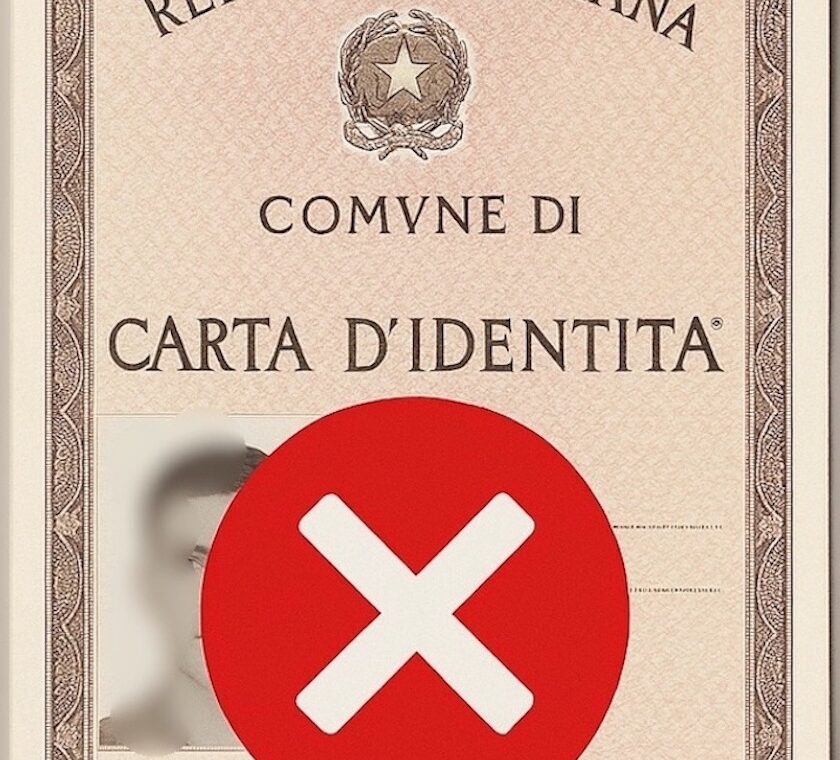 Foto di una carta di identità cartacea con una X rossa